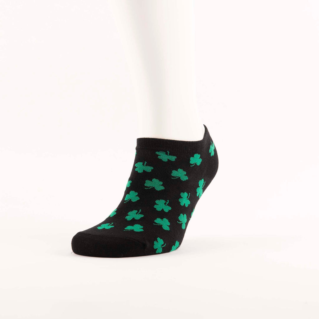 Balck ankle sock with green shamrocks on foot